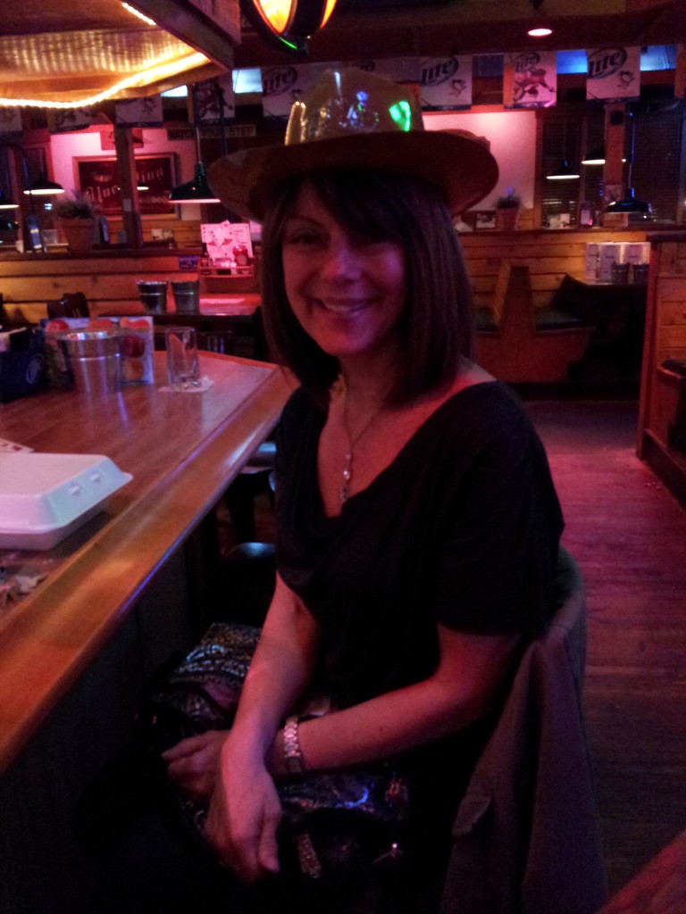 She's not even embarrassed to wear the hat at Texas Roadhouse!